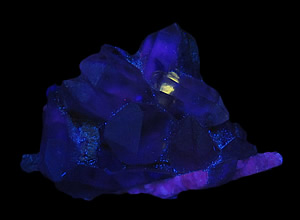 Topaz, Fluorite and Quartz Included by Fluorite, Phlogopite and Unknown, Un San Mine, Hunan Province, China in SWUV